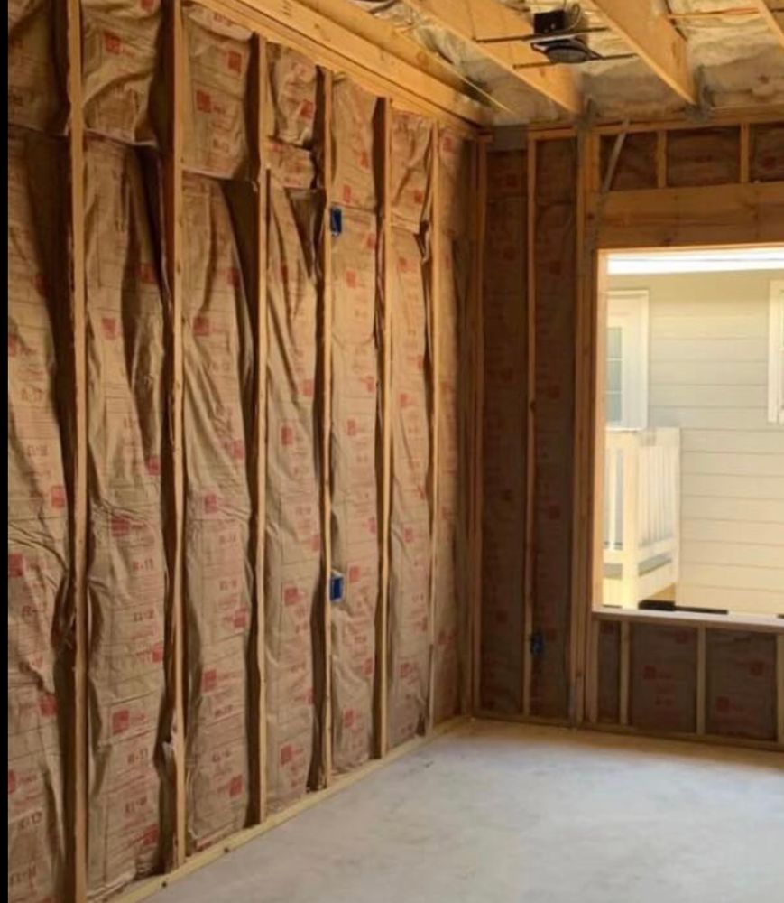 Batt insulation installed in the framed walls of a home under construction